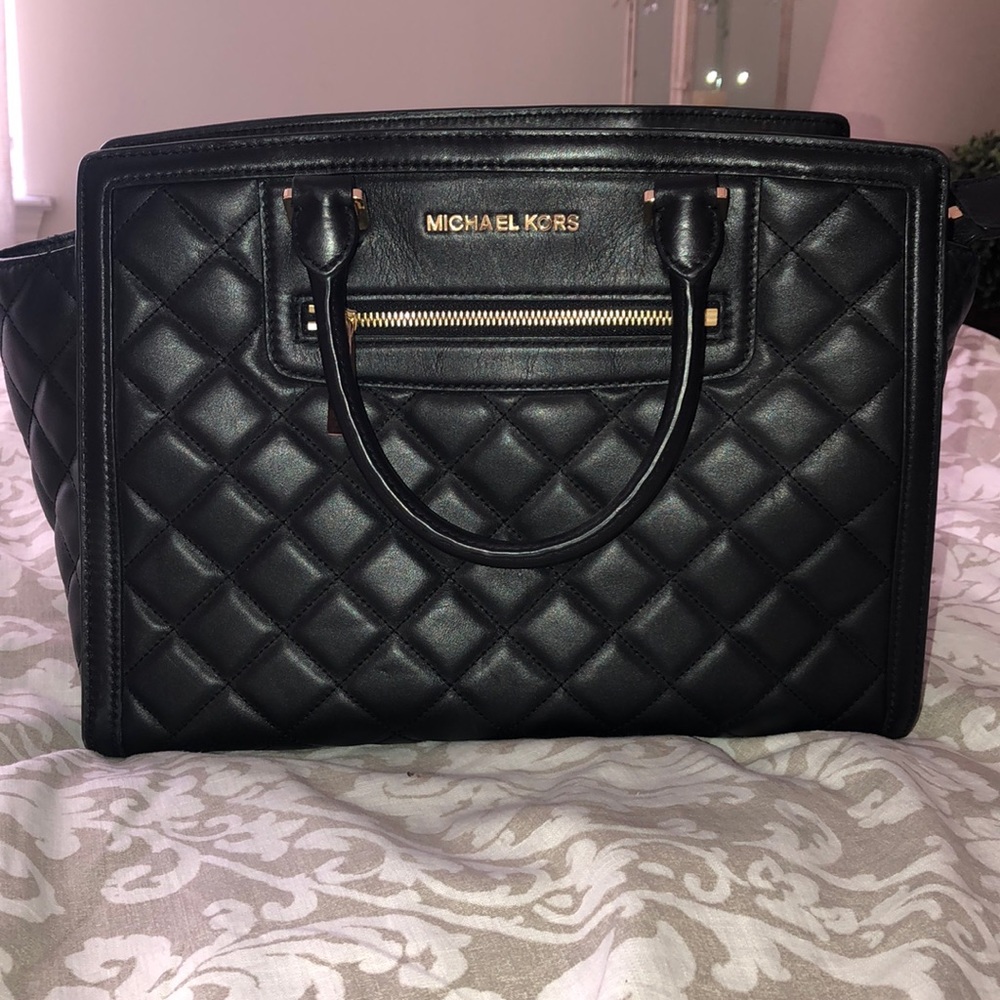 Black quilted leather Michael Kors purse.